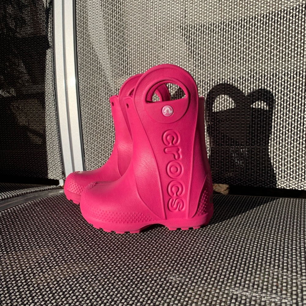 Pink rain boots by Crocs